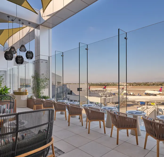 The landscaped terrace, featuring seating for 26, includes accent pillows furnished by Delta One luxury brand partner Missoni. 