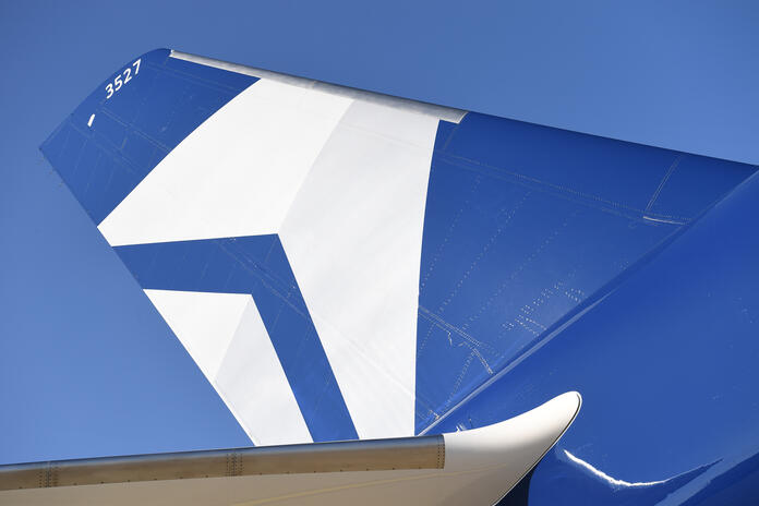 The tail of Delta's Centennial livery, which features the airline's Centennial colors: blue and silver.