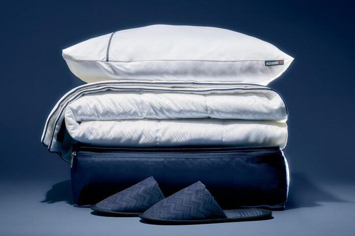 A stack of Delta's new Delta One bedding, created in partnership with Missoni