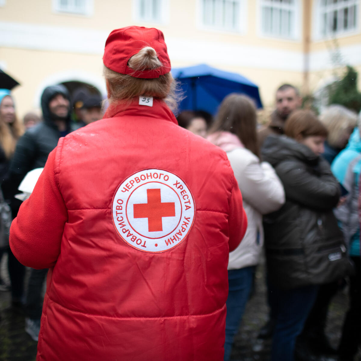 A Red Cross worker helps people in Ukraine.