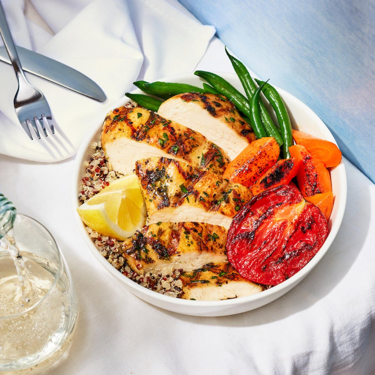 Hearty, simply prepared roasted chicken comes with quinoa, green beans, roasted carrots and Roma tomato.