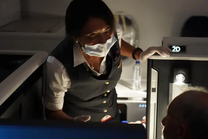 Delta Air Lines Flight Attendant serves passengers during CRAF mission.