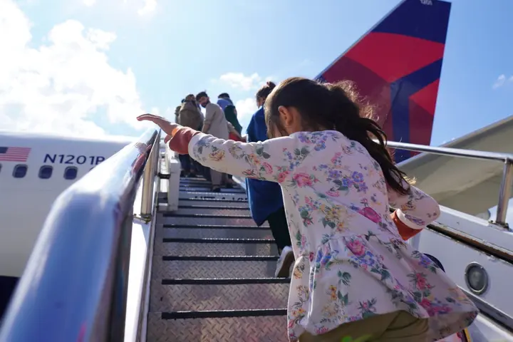 Evacuees from Afghanistan board at Ramstein air base.