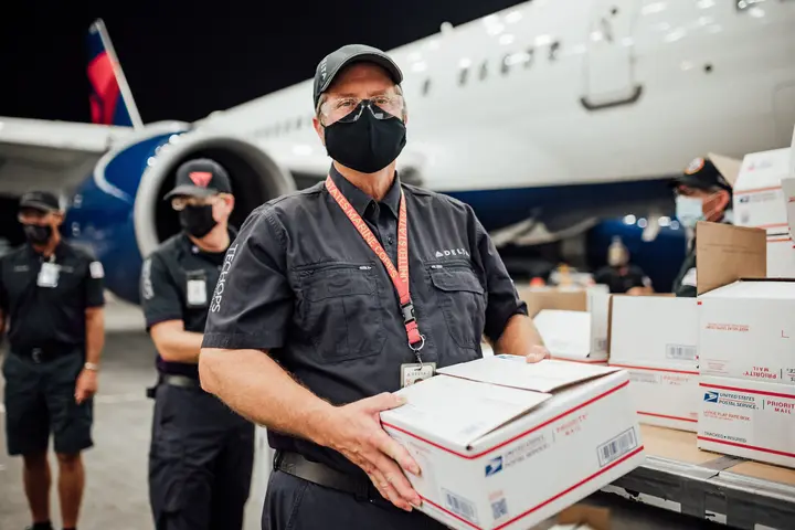 TechOps employee and veteran ships out 7,000th care package to military 