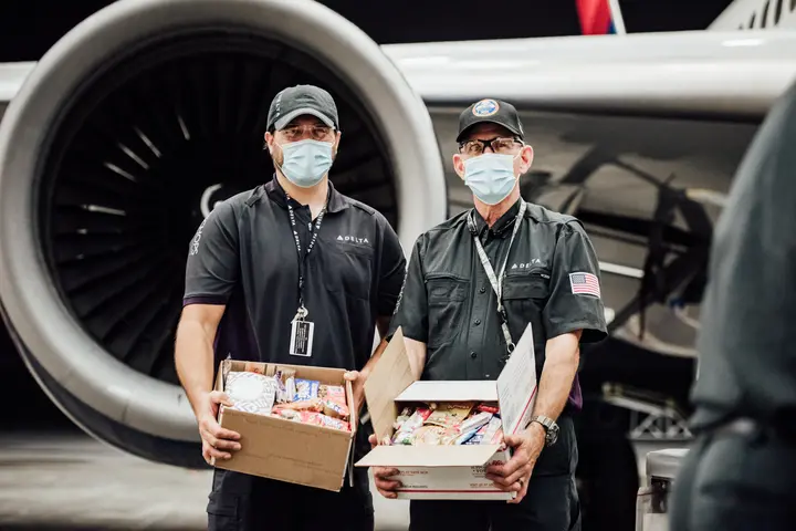 TechOps employee and veteran ships out 7,000th care package to military
