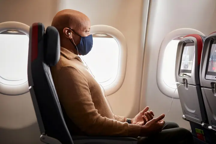 A customer enjoys some of Delta's in-flight wellness offerings.