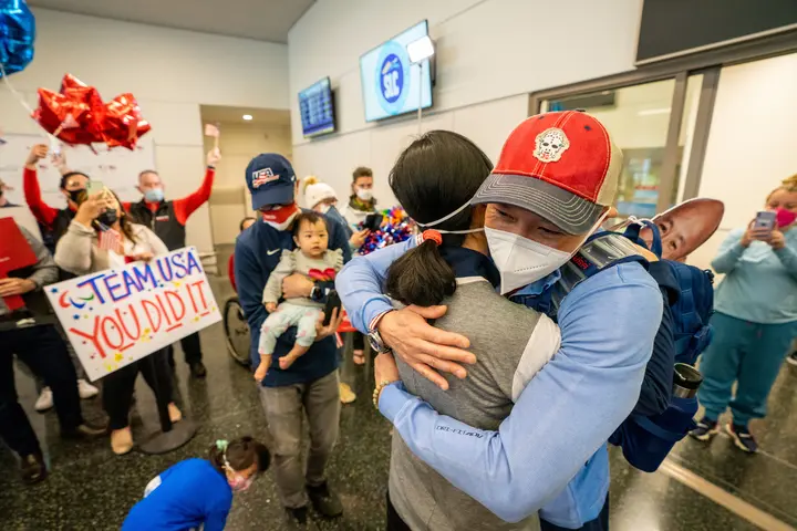 Jen Lee embraces his family.