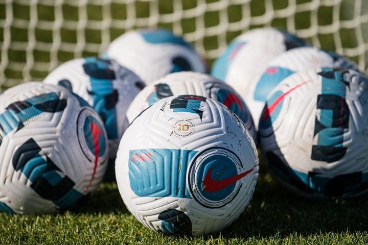 Arrary of soccer balls announcing partnership with National Women’s Soccer League 