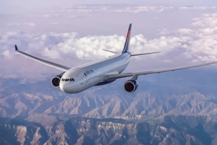 A330-300 in flight over mountains