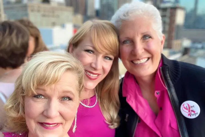 Flight attendant Linda Schlappy poses with Delta colleagues.