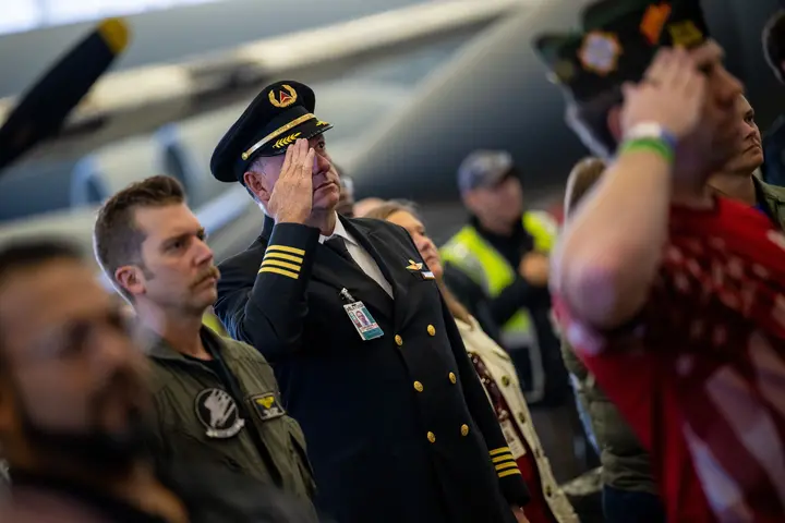A Delta pilot salutes during the veterans appreciation event on Nov. 4, 2022.