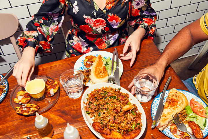 People dine at a table.