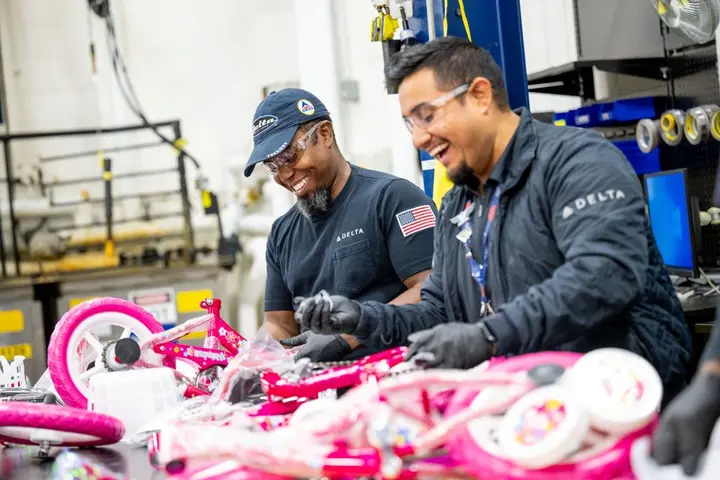 Delta people from TechOps, In-Flight Service, Global Sales, Finance, IT and Flight Operations rallied to purchase and assemble bicycles, as well as rally toy and money donations to support Toys for Tots.