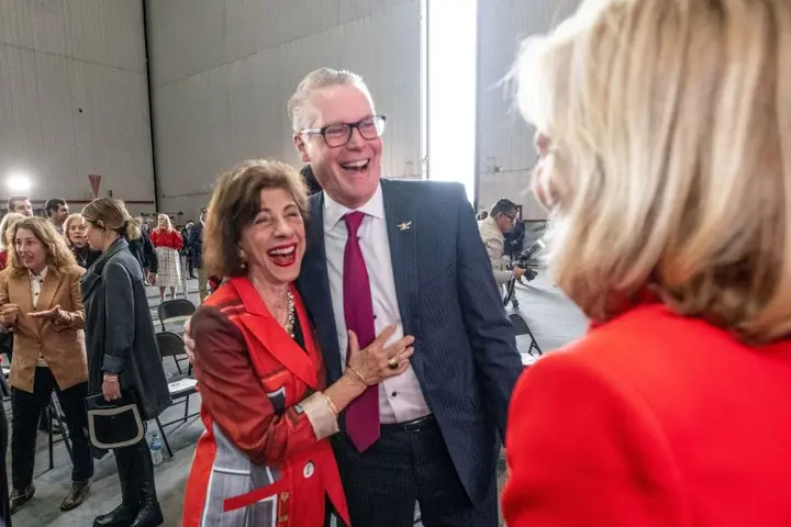 Ed Bastian and Barbara Dooley as the ceremony commemorating the life and legacy of renowned University of Georgia football coach Vince Dooley with the dedication of a Boeing 767-400 featuring a memorial seal honoring the Hall of Famer.  