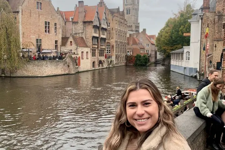 A Delta employee stands on the riverfront in Brussels.