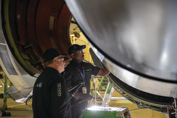 Two Delta TechOps employees are shown working in this 2020 photo.