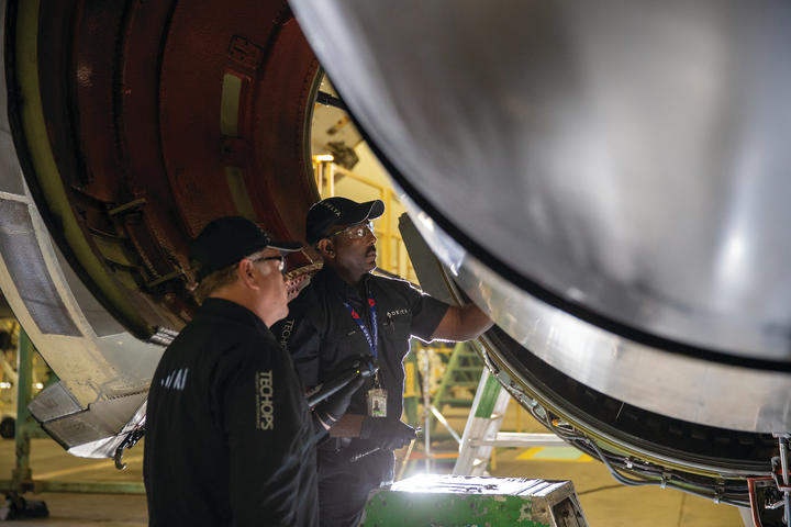 Two Delta TechOps employees are shown working in this 2020 photo.