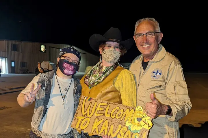 Delta pilot Barry Behnfeldt greets fans in Coffeyville, Kansas during his Guinness World Record attempt at flying through 48 states in 48 hours.