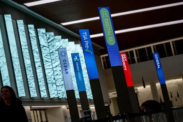 An airport with different check ins, including Delta's Digital ID.