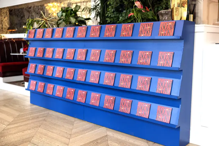 Within the Delta Lounge, a newsstand displays copies of Delta's Ascend zine, a curated guide to SXSW 2024. 