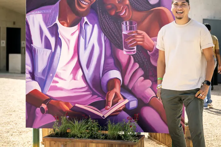 Delta, in partnership with Waterloo Greenway and Future Front Texas, demonstrated its commitment in Austin with the unveiling of a new mural, co-designed by the airline and local artists Ruben Esquivel of East End Eclectic and Kat Talley. Ruben poses next to the mural, which reflects a human-centric, connected vision for the future of the Austin community.
