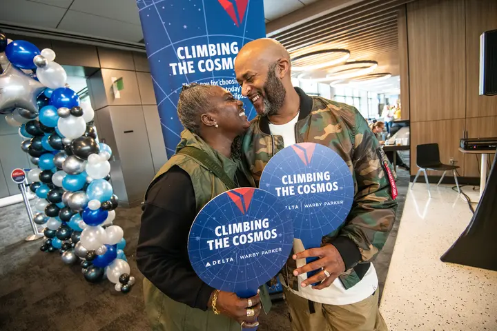 A Delta employee and her husband enjoy the festivities in AUS ahead of one of Delta's two eclipse flights on April 8, 2024.