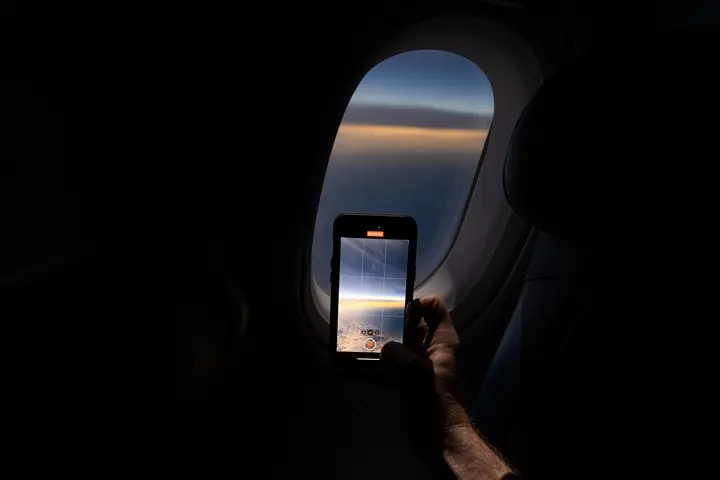 Customers on board DL 1010 from Dallas Fort Worth International Airport (DTW) to Detroit Wayne County Metropolitan Airport (DFW) view the solar eclipse.
