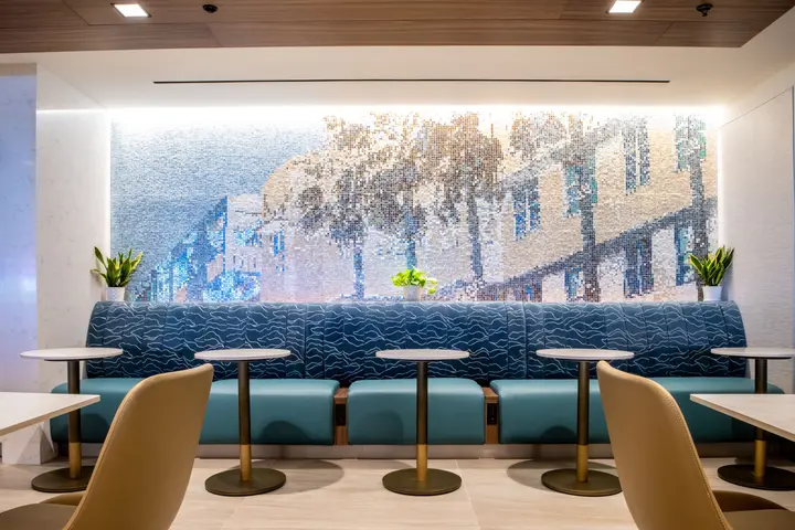 A new mosaic pays homage to the city’s classic Art Deco architecture, while the overall color palette reflects the nearby turquoise waters, blue sky, and white and gold accents seen in south Florida designs. 