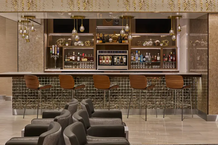 The Delta Sky Club at Detroit Metropolitan Airport features a premium bar that provides guests with access to complimentary beverages as well as upgraded options like premium wines, spirits, beer and signature cocktails. 