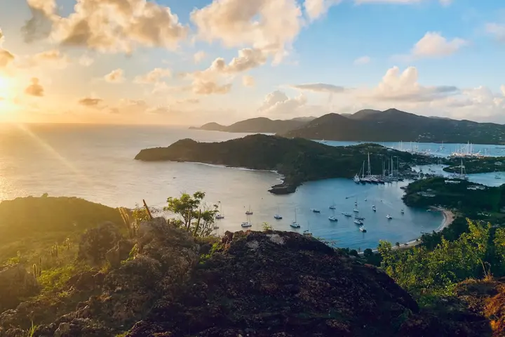 A bay filled with boats during sunset in the Caribbean island of Antigua and Barbuda