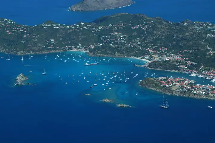An aerial view of St. Kitts and Nevis with several yachts