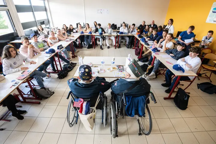 During the program, the WWII veterans participated in a school visit, engaging with 1,200 middle school and high school students by sharing their stories.