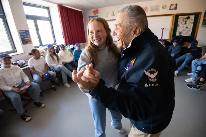 During the program, the WWII veterans participated in a school visit, engaging with 1,200 middle school and high school students by sharing their stories.