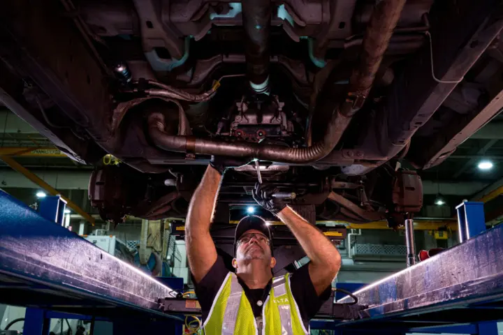 A member of Delta's Ground Support Equipment team helps maintain machinery.