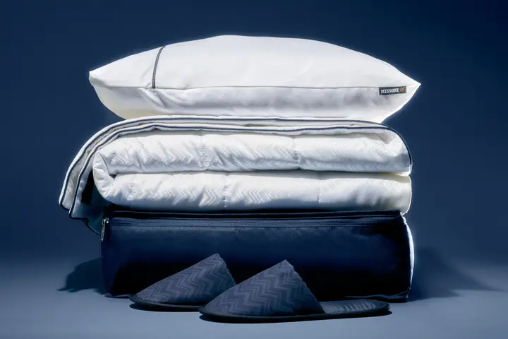 A stack of Delta's new Delta One bedding, created in partnership with Missoni