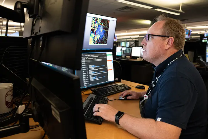 Warren Weston, a member of Delta's in-house meteorology team, working inside the Operations and Customer Center in Atlanta.