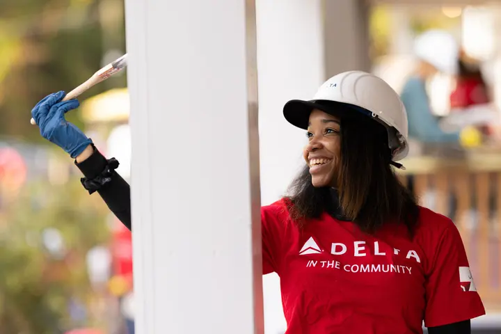 A Delta employee volunteers with Habitat for Humanity.