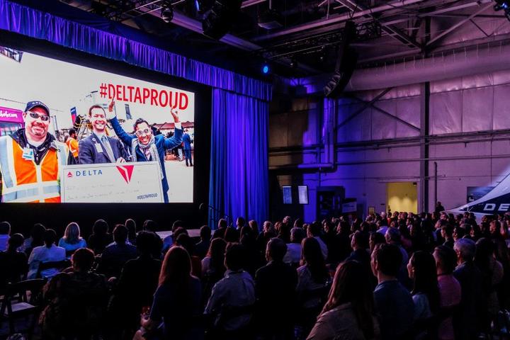 Delta employees watch the screening of Delta's documentary "The Steepest Climb."