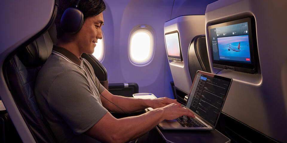 A customer uses their personal device onboard