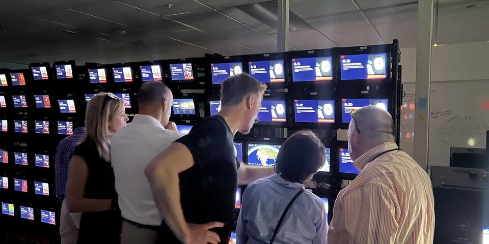 Members of the Advisory Board on Disability test Delta's new flight map in the In-Flight Entertainment lab.