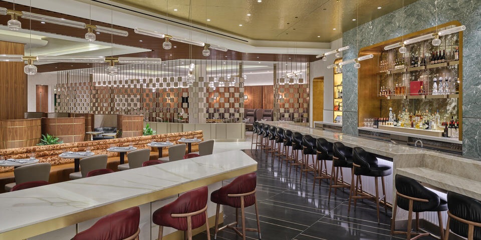 A view of the bar seats at the LAX Delta One Lounge. The entire lounge includes seating for nearly 200 guests.