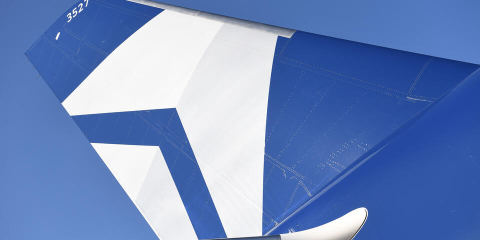 The tail of Delta's Centennial livery, which features the airline's Centennial colors: blue and silver.