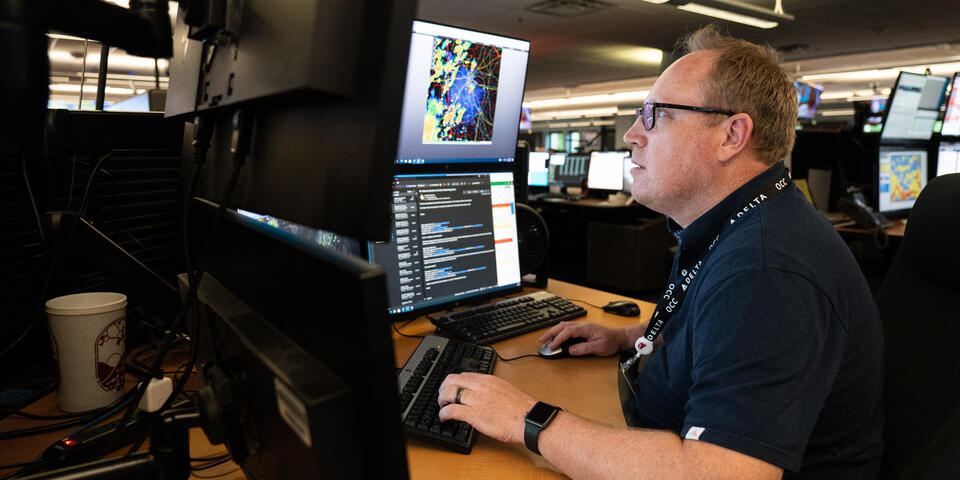Warren Weston, a member of Delta's in-house meteorology team, working inside the Operations and Customer Center in Atlanta.