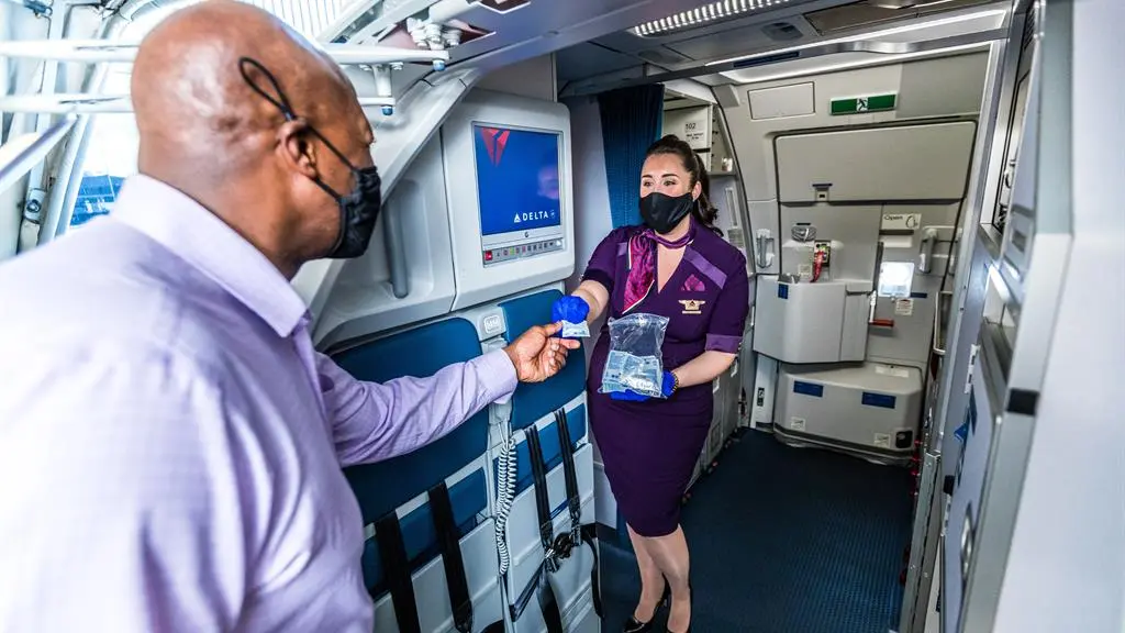 Delta hand sanitzer while boarding
