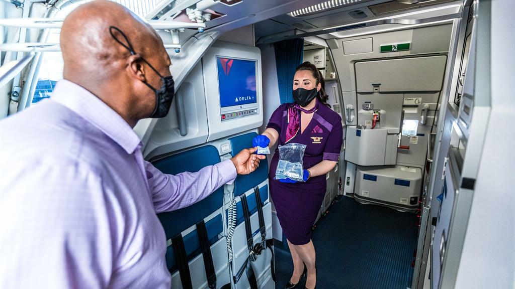 Delta hand sanitzer while boarding