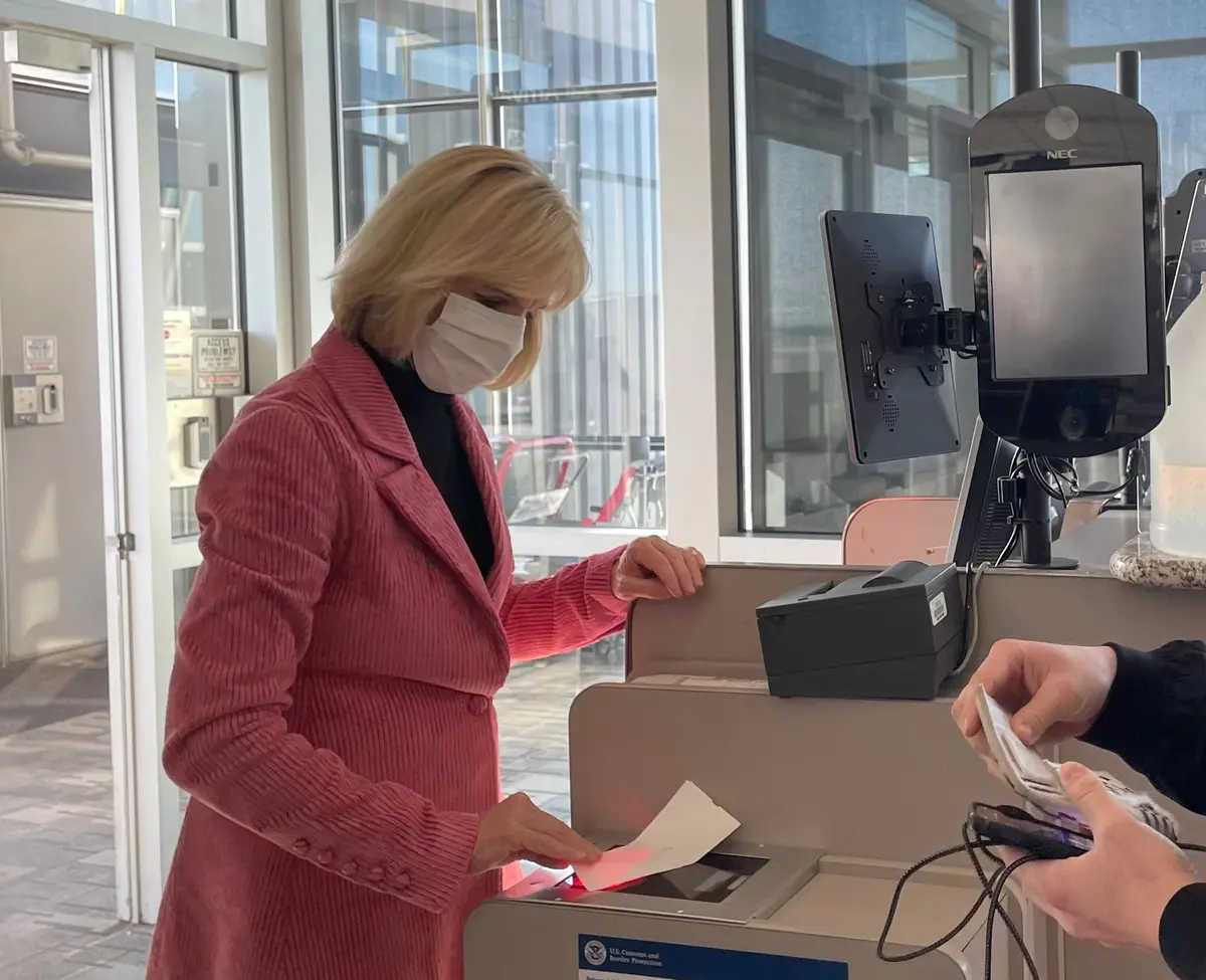 E.V.P. and Chief Customer Experience Officer Allison Ausband spends time scanning boarding passes at Delta's MSP hub.