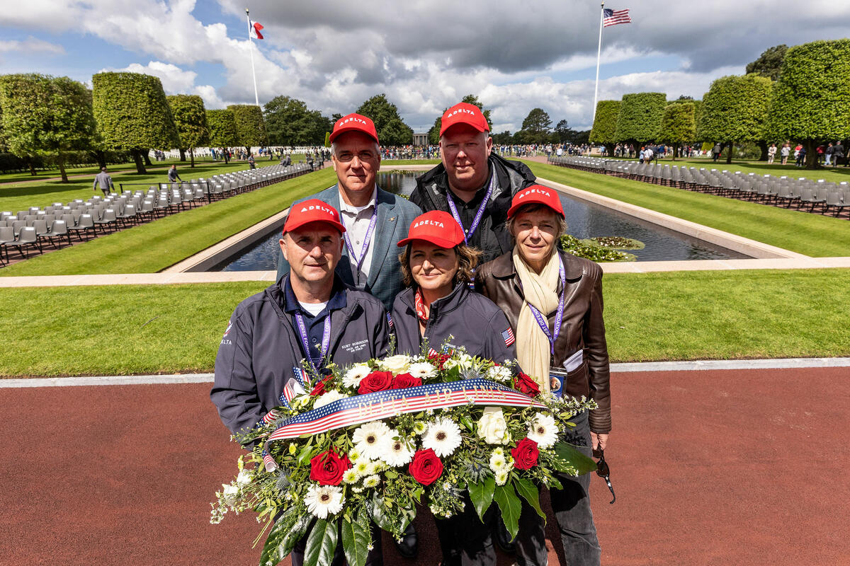 Delta’s Kurt Robinson, Virginie Durr, Beatrice deRotalier, Chris Jones and Paul Hassenstab at Normandy American Cemetery and Memorial on D-Day.