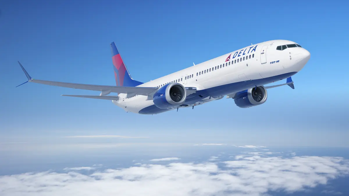 Boeing 737-10 in flight over clouds