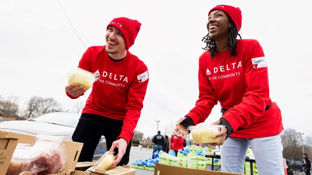 Two Delta employees volunteer at Hosea Helps in Atlanta during the annual "Hosea Helps Festival of Services" event.