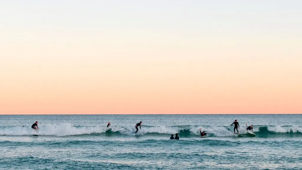 Surfers catch waves at Bondi Beach in Sydney, Australia